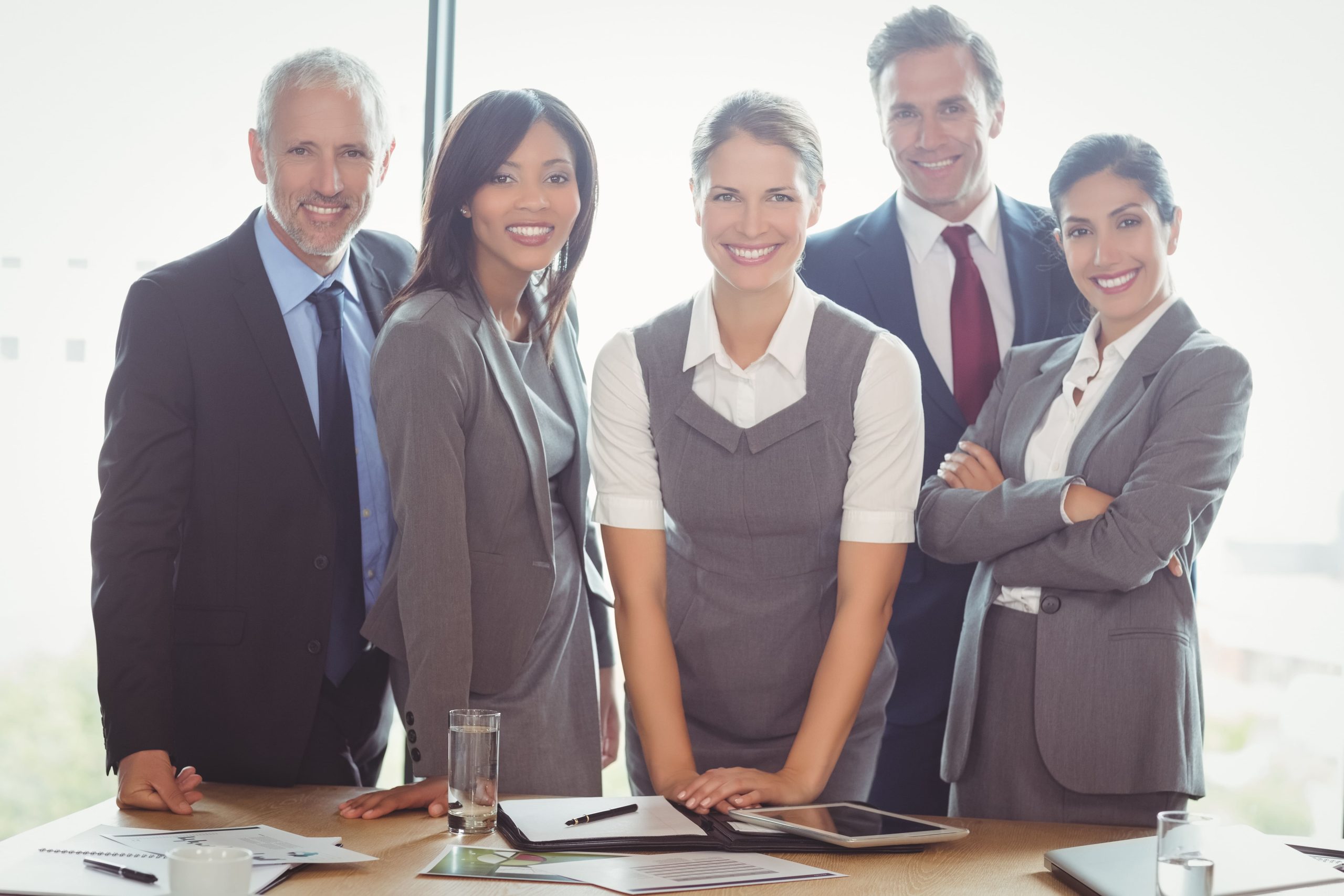 Businesspeople standing together in conference room