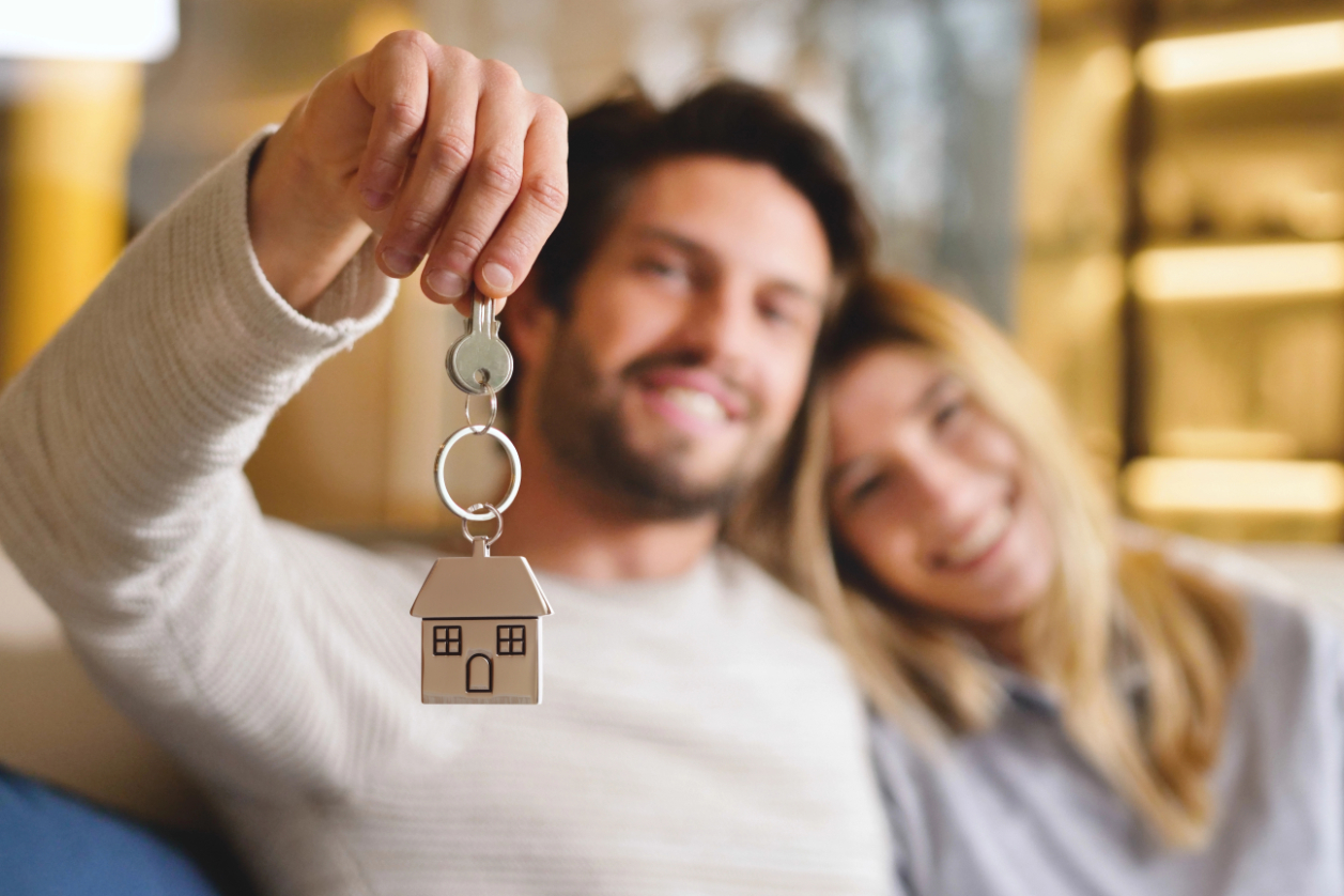 Couple holding new house keys