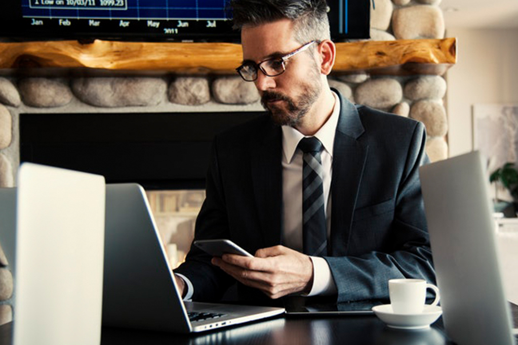 Businessman using a laptop at work