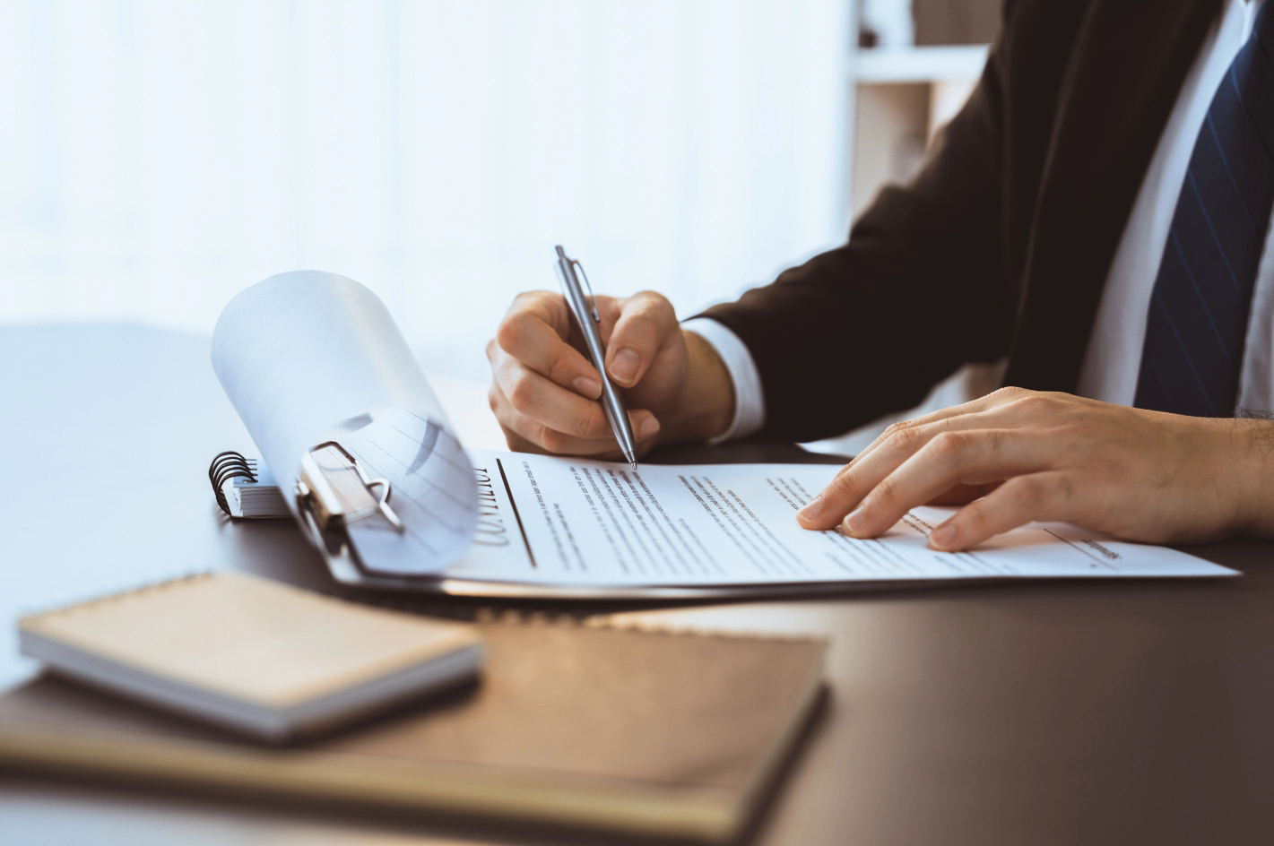 Businessman Signs Contract Agreement Paper